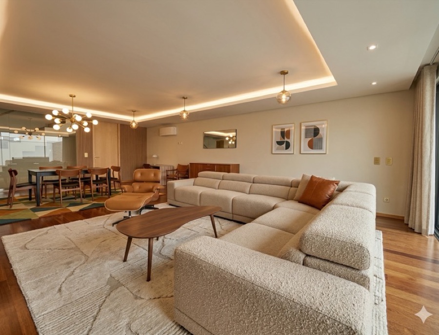 A room restyled in Mid-Century Modern design — walnut and cognac leather.